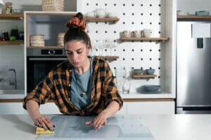 woman in her kitchen is experiencing symptoms of contamination ocd